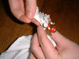 and attach the figurine to maintain the napkin